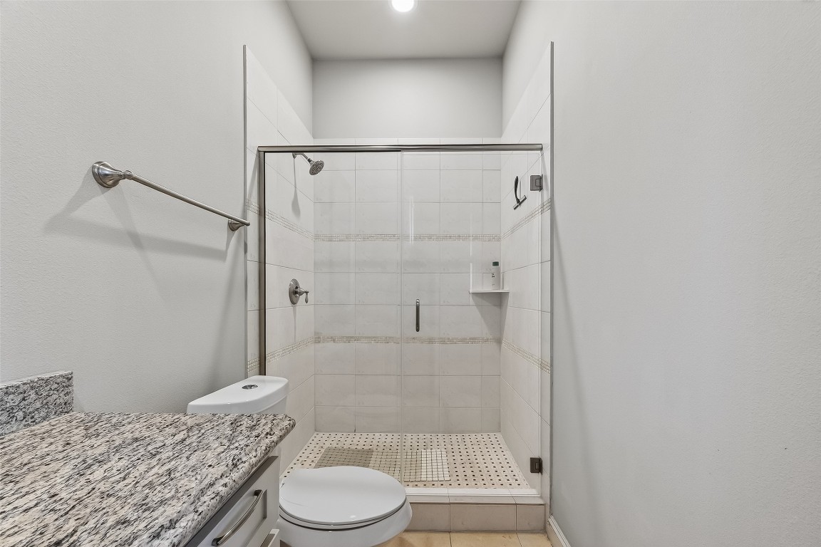 605 Meadow Street Houston, TX 77020 - Photo 17 of 31 a bathroom with a granite countertop sink toilet and shower