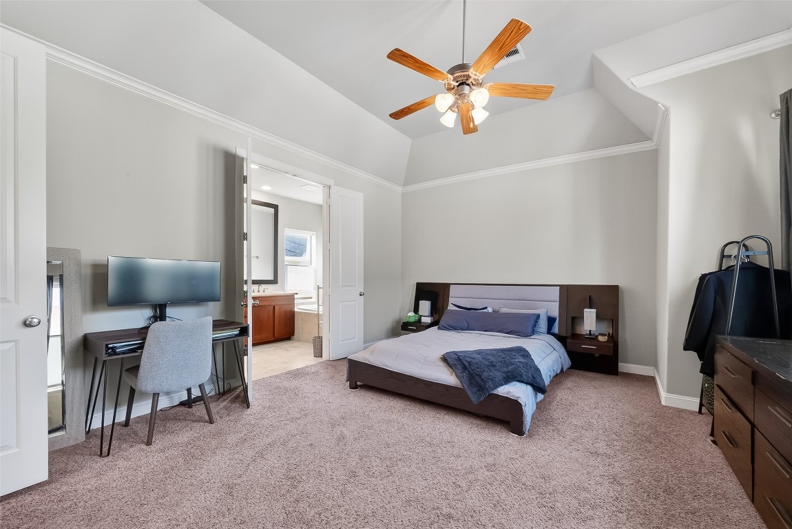 605 Meadow Street Houston, TX 77020 - Photo 23 of 31 a spacious bedroom with a bed and a chandelier