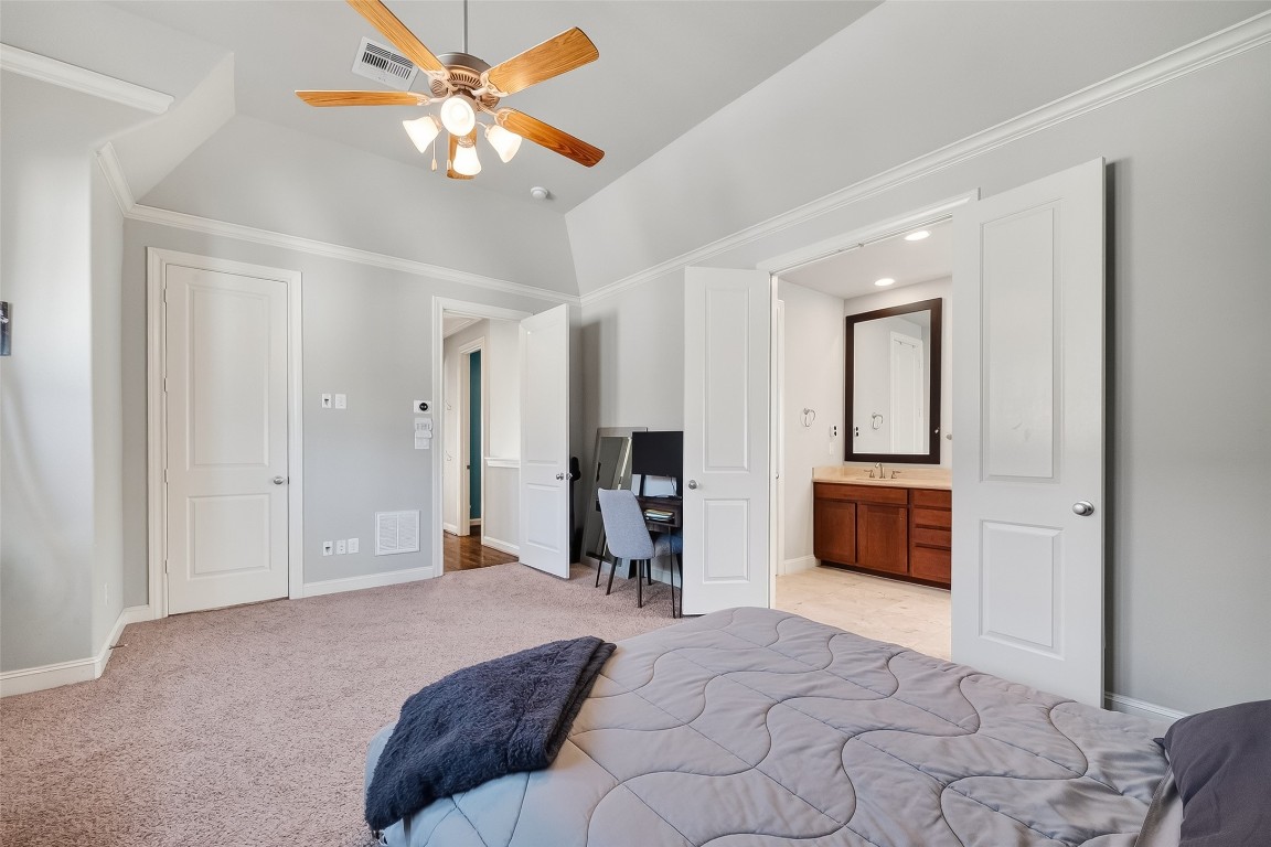 605 Meadow Street Houston, TX 77020 - Photo 24 of 31 a bedroom with furniture and a chandelier
