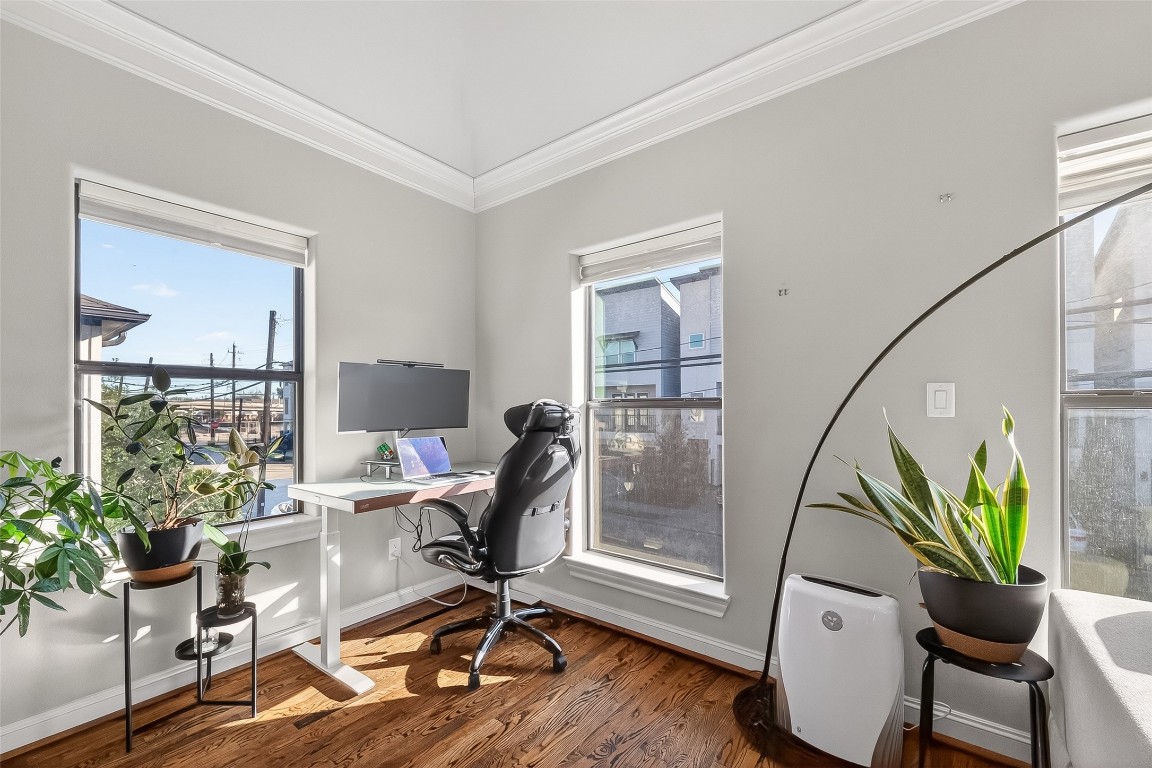 605 Meadow Street Houston, TX 77020 - Photo 5 of 31 a view of a workspace with furniture and a window