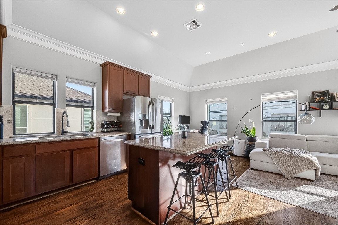 605 Meadow Street Houston, TX 77020 - Photo 9 of 31 a view of a dining room with furniture window and wooden floor
