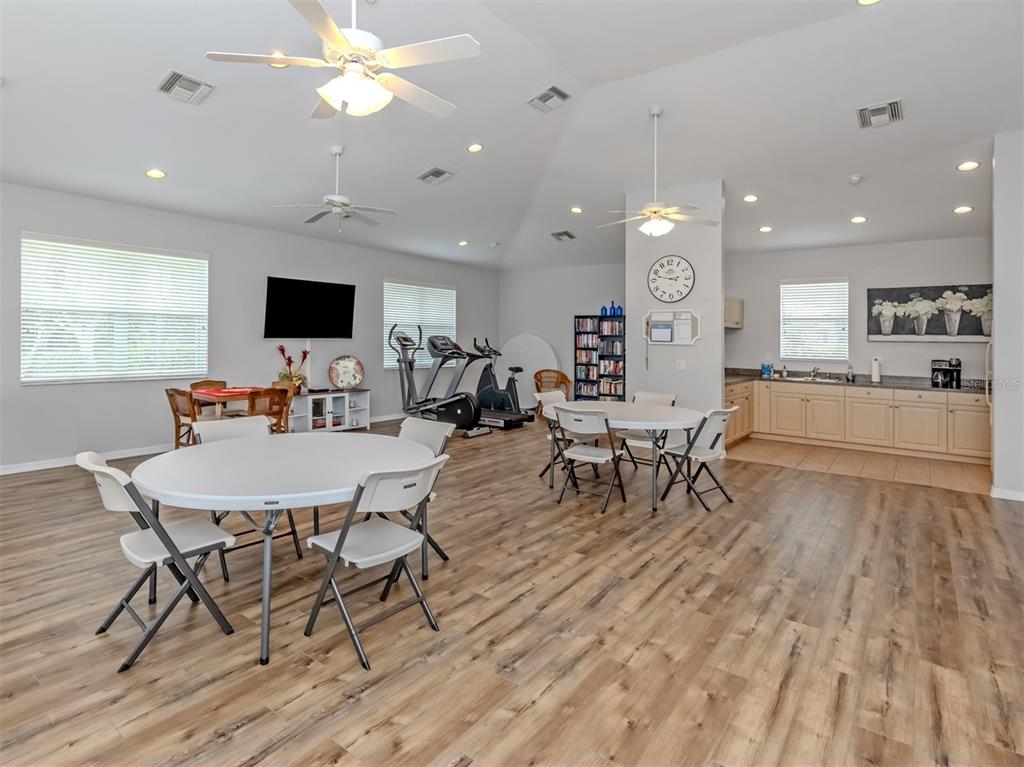 205 Reclinata Circle Venice, FL 34292 - Photo 35 of 62 a living room with furniture and a flat screen tv