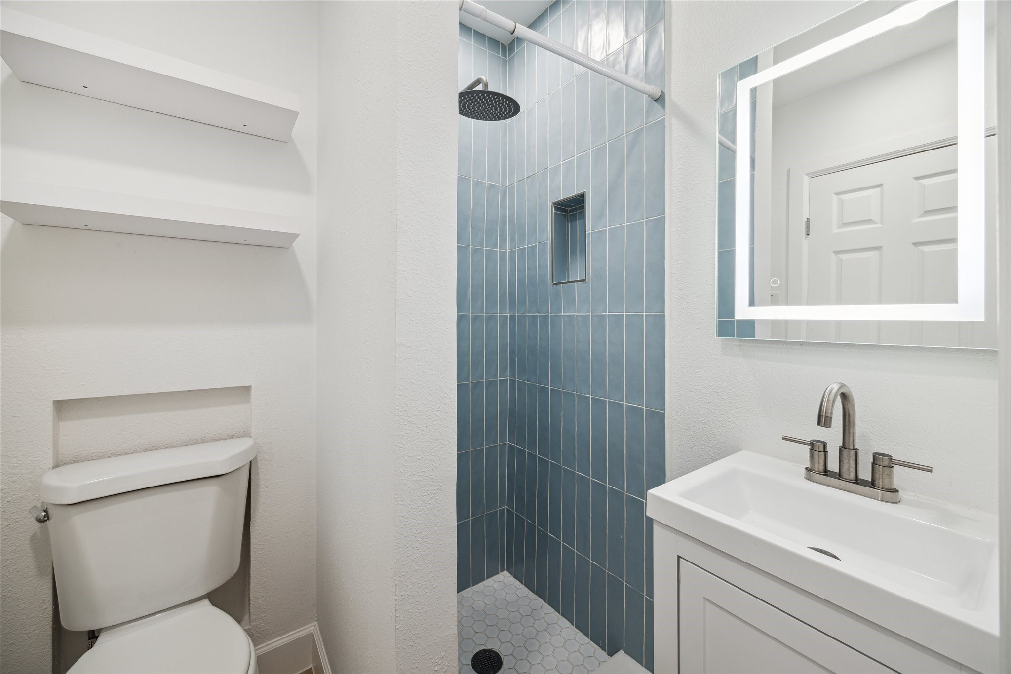 1419 Laird Street Houston, TX 77008 - Photo 14 of 15 a bathroom with a sink a toilet and shower