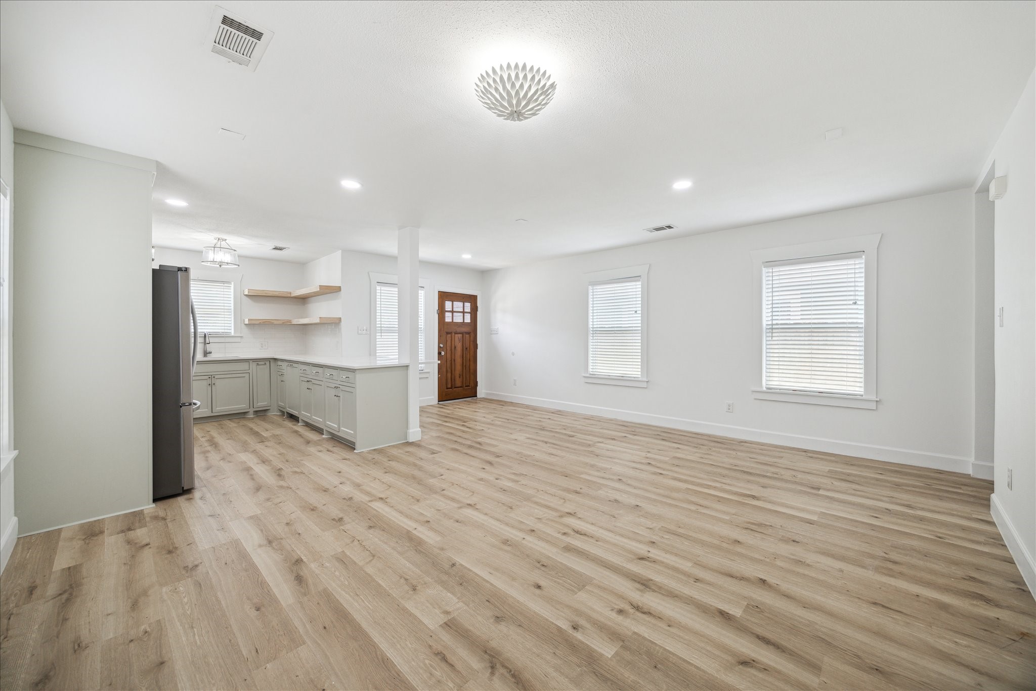 1419 Laird Street Houston, TX 77008 - Photo 8 of 15 a view of empty room with wooden floor
