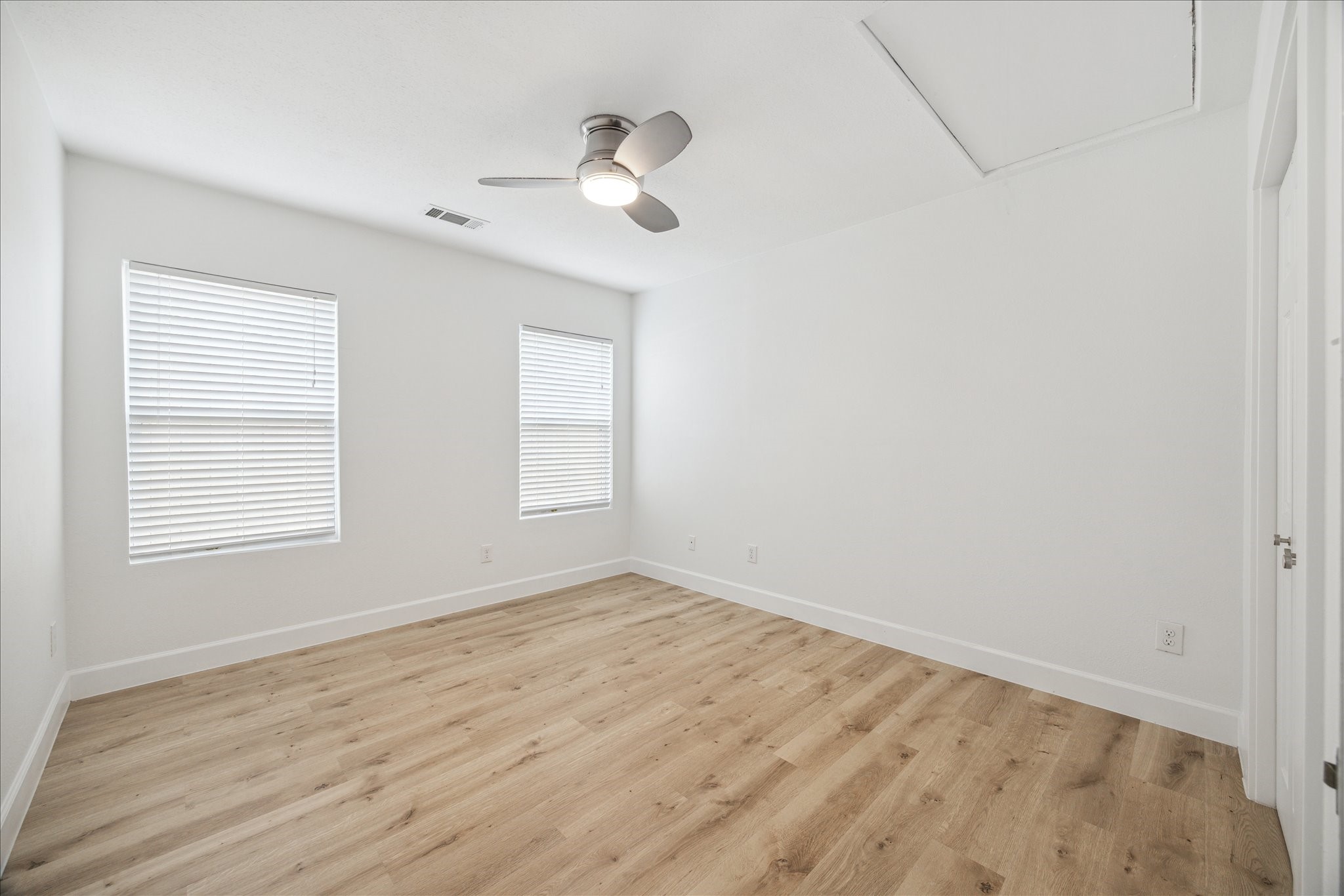 1419 Laird Street Houston, TX 77008 - Photo 10 of 15 wooden floor in an empty room with a window