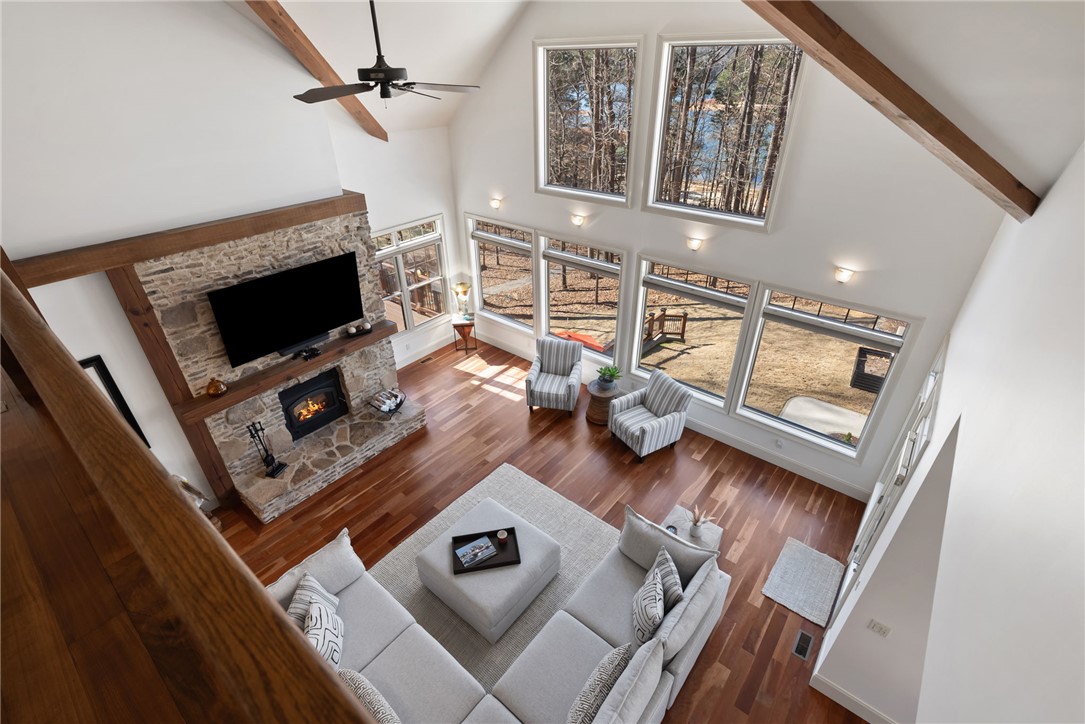 505 Northview Court Fair Play, SC 29643 - Photo 25 of 48 This airy great room features expansive windows, a captivating stone fireplace, and gleaming hardwood floors.