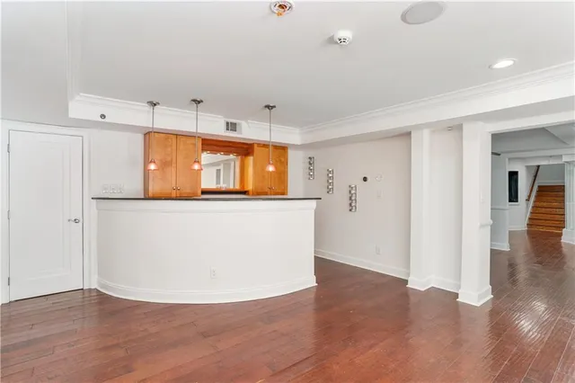 an aerial view of a house with a yard and pool