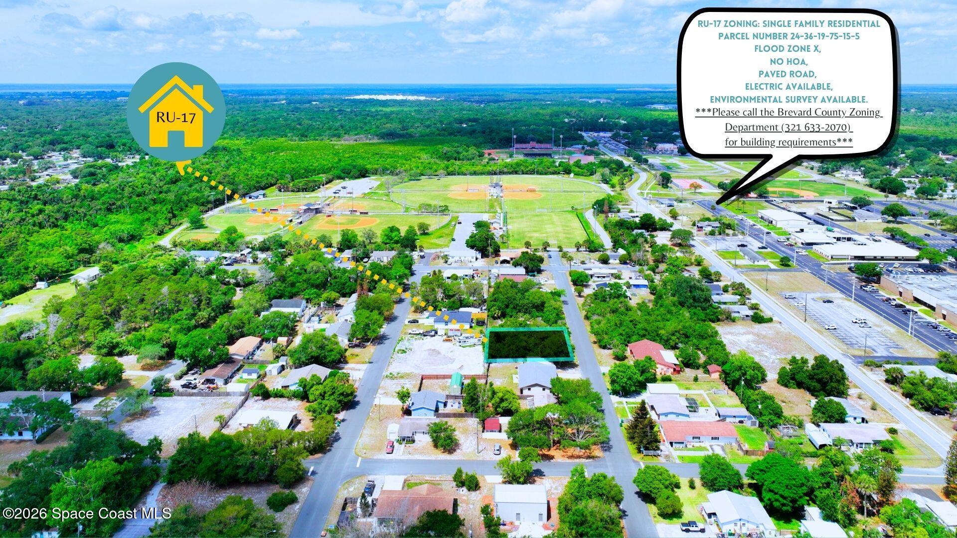 1727 Ruth Street Cocoa, FL 32926 - Photo 2 of 10 a view of a swimming pool with a garden