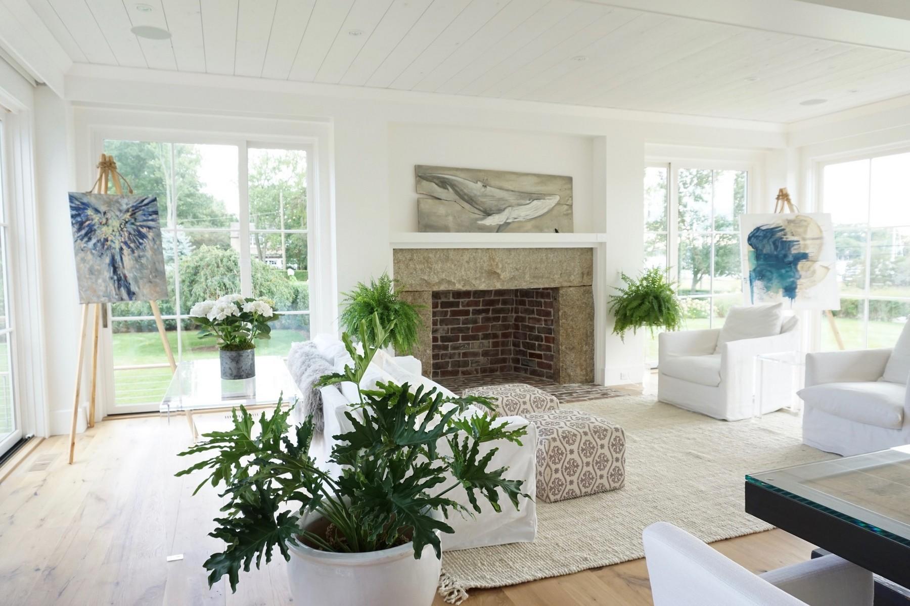 106 Pear Tree Point Road Darien, CT 06820 - Photo 11 of 43 a living room with furniture and a fireplace