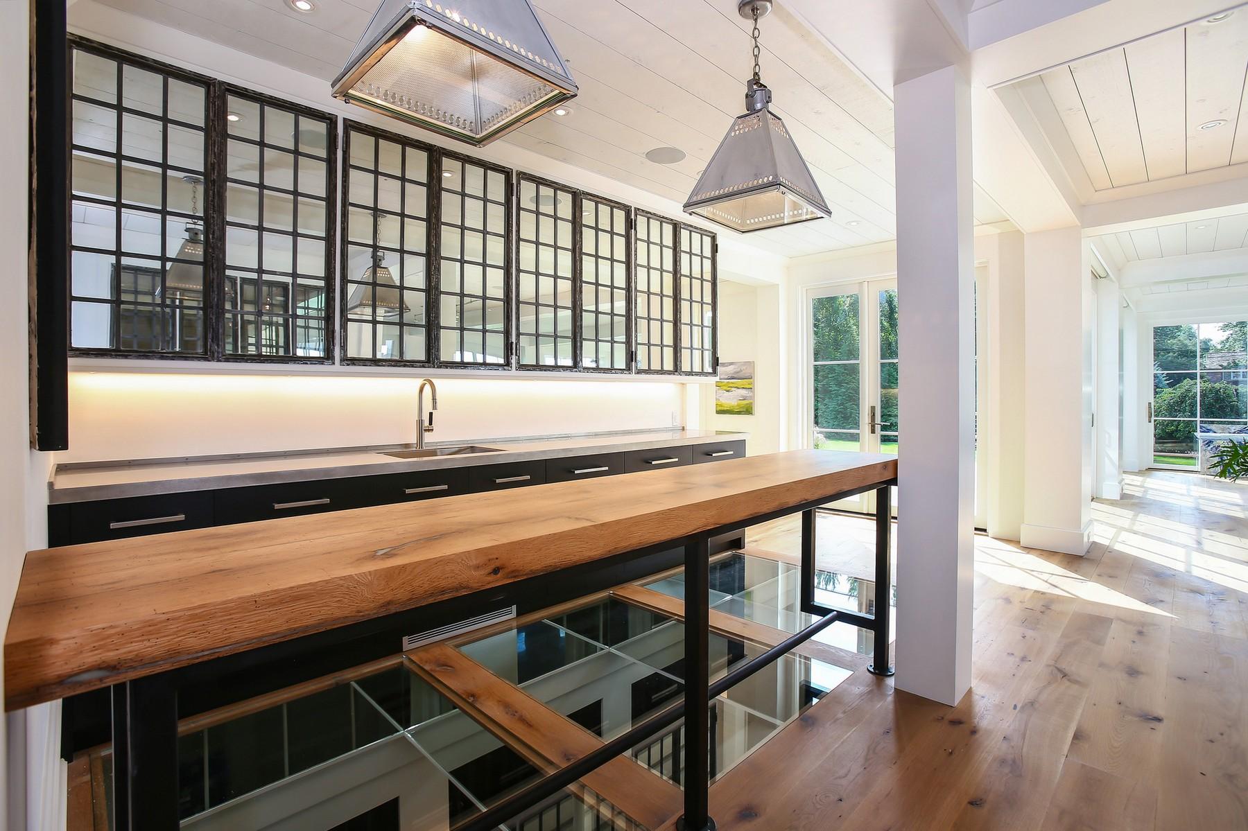 106 Pear Tree Point Road Darien, CT 06820 - Photo 12 of 43 a view of a room with wooden floor and windows