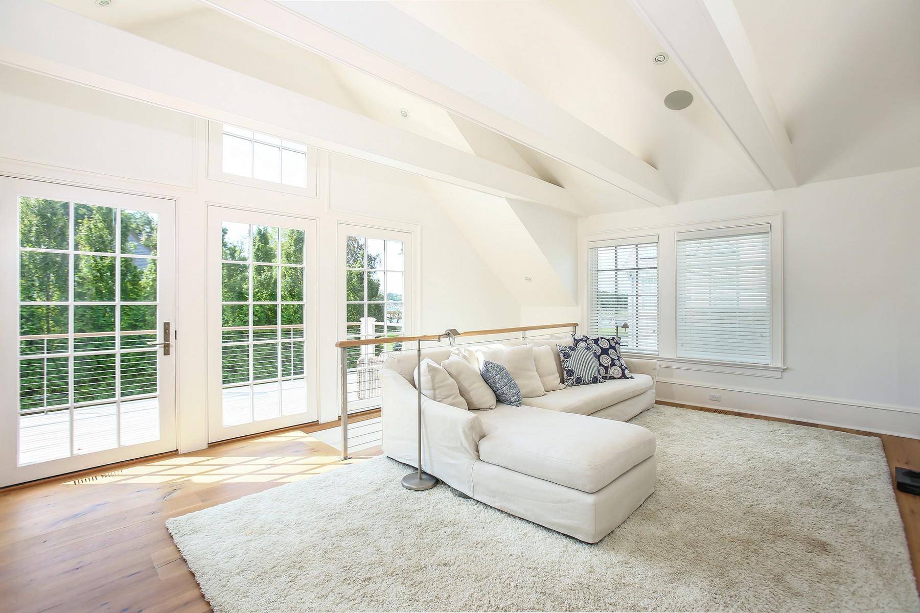 106 Pear Tree Point Road Darien, CT 06820 - Photo 26 of 43 a living room with furniture and windows