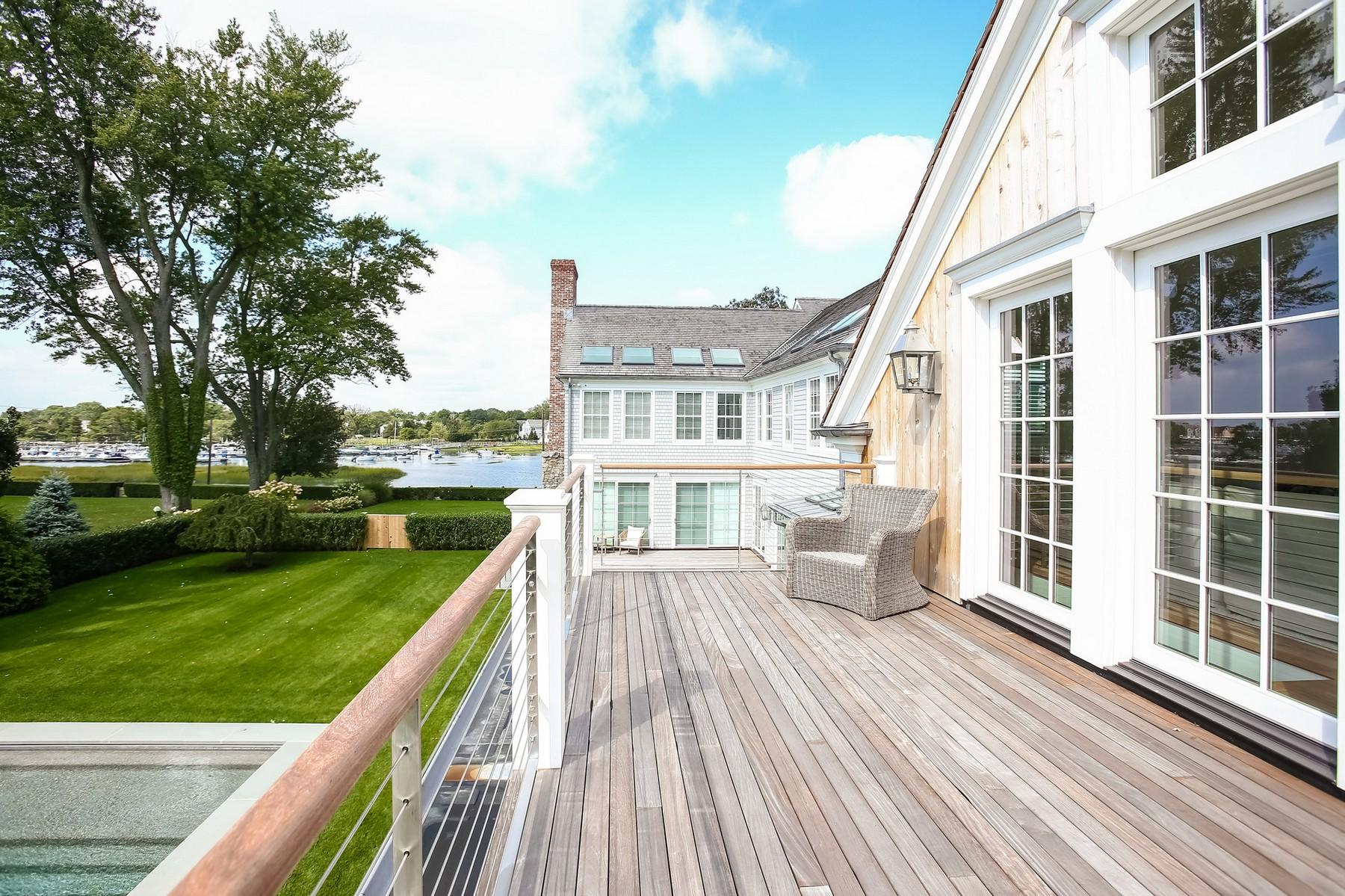 106 Pear Tree Point Road Darien, CT 06820 - Photo 27 of 43 a view of a house with a yard