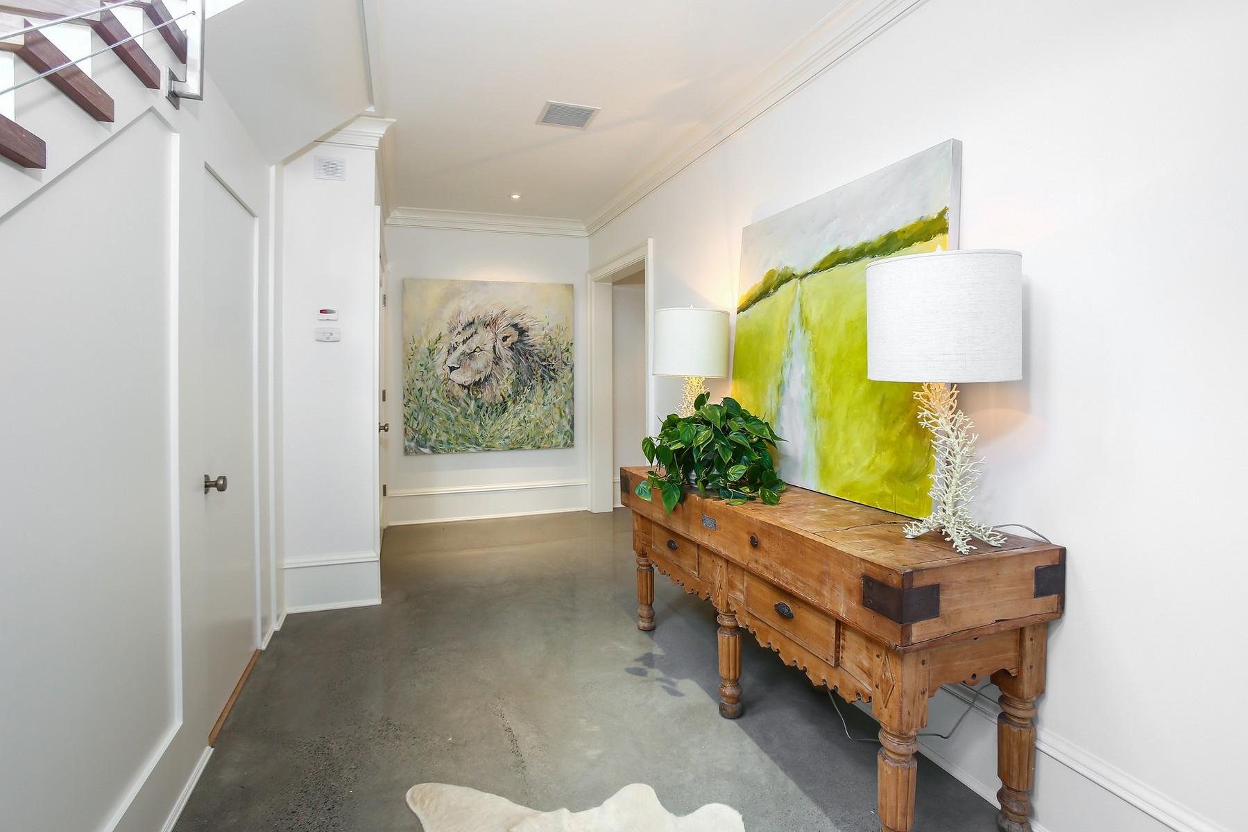 106 Pear Tree Point Road Darien, CT 06820 - Photo 28 of 43 a living room with furniture and a lamp