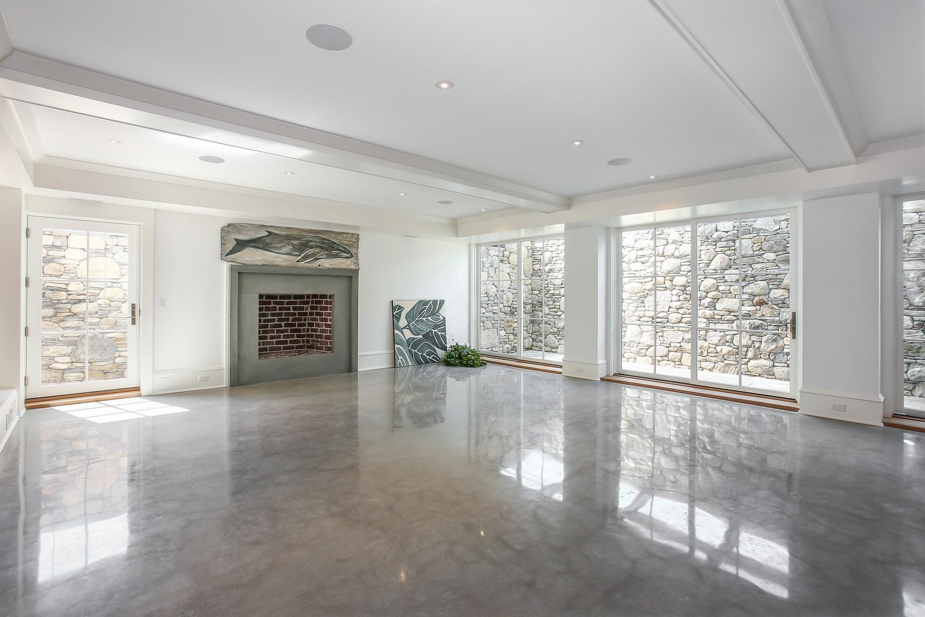 106 Pear Tree Point Road Darien, CT 06820 - Photo 30 of 43 a view of an empty room with window and fire place