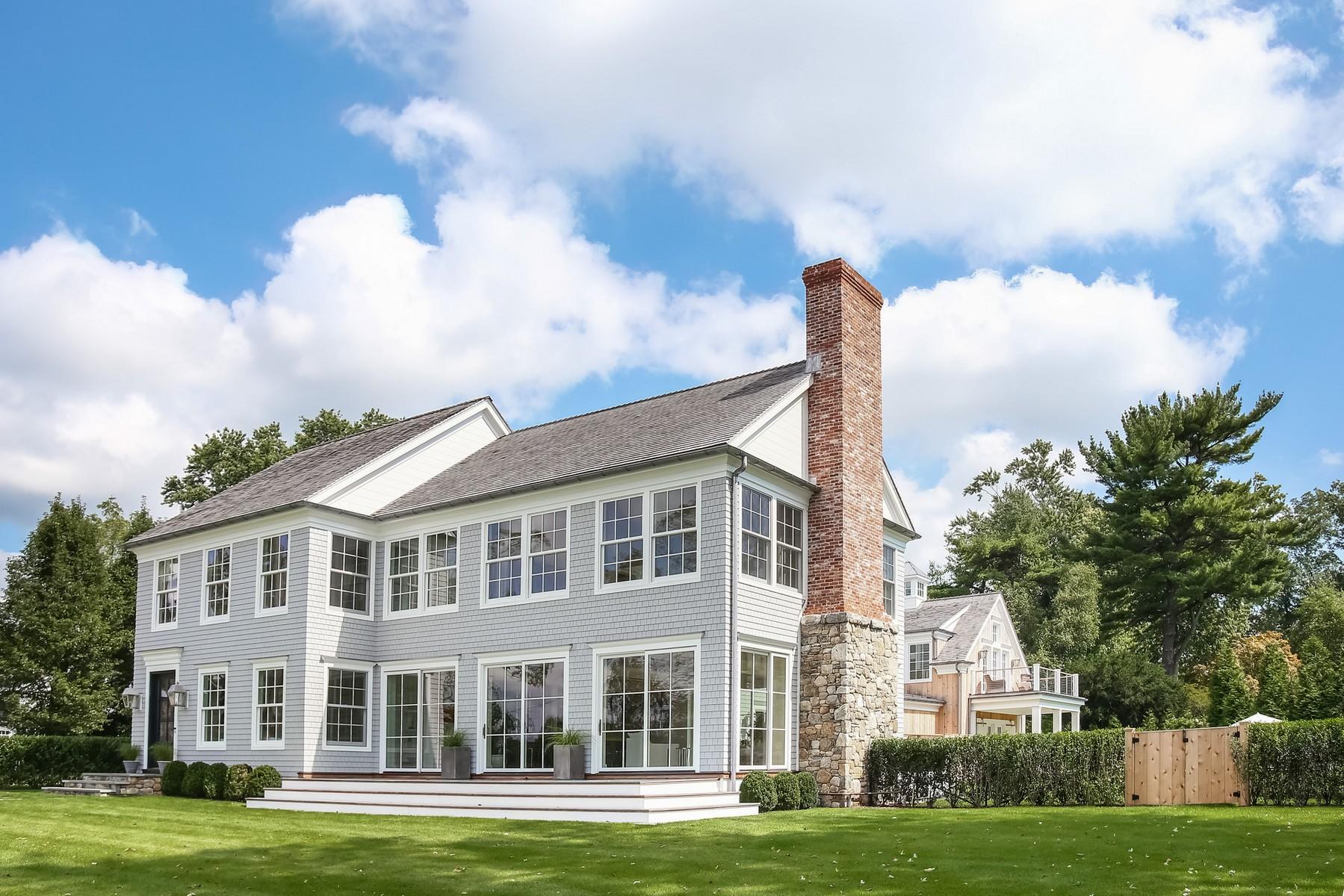 106 Pear Tree Point Road Darien, CT 06820 - Photo 3 of 43 a front view of a house with a garden