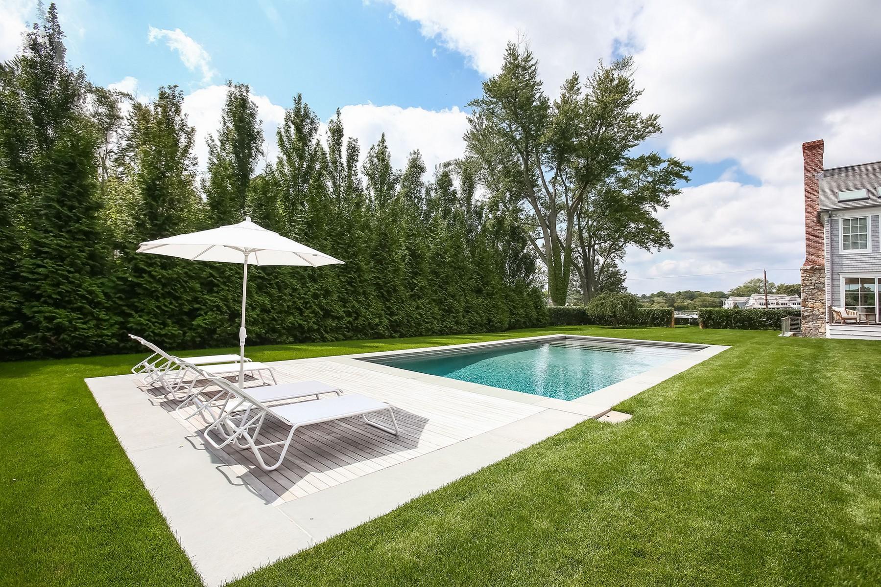 106 Pear Tree Point Road Darien, CT 06820 - Photo 32 of 43 a view of a backyard with a tub