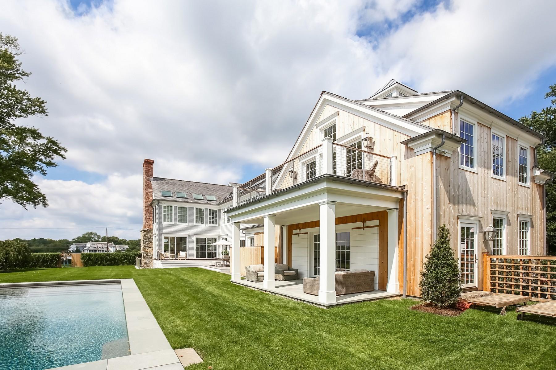 106 Pear Tree Point Road Darien, CT 06820 - Photo 34 of 43 a view of a house with a yard and plants