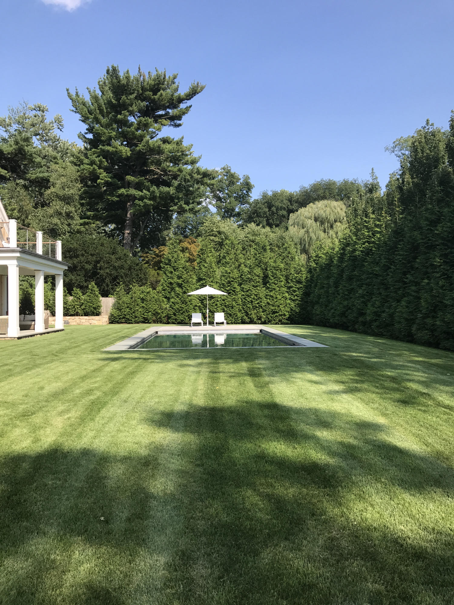 106 Pear Tree Point Road Darien, CT 06820 - Photo 4 of 43 a view of a house with a yard