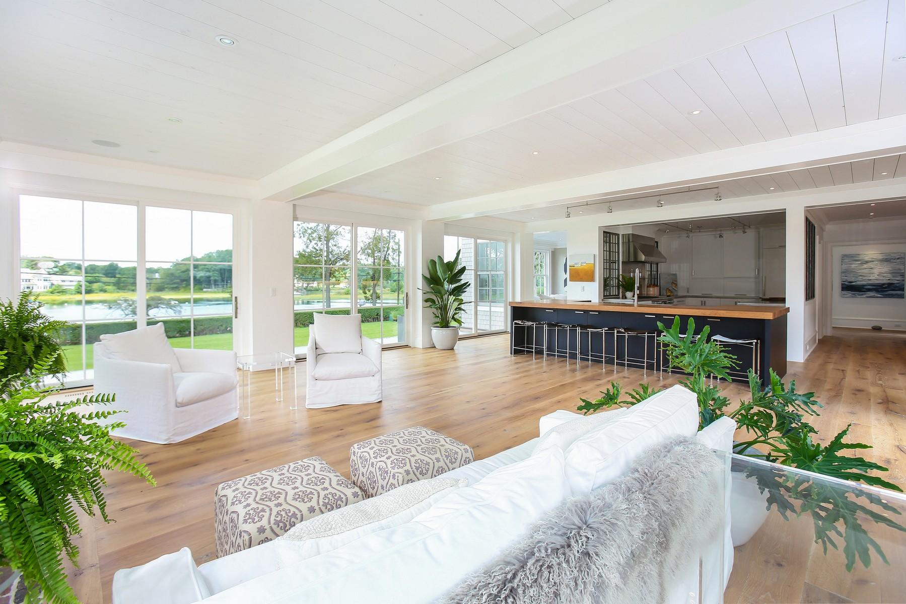 106 Pear Tree Point Road Darien, CT 06820 - Photo 10 of 43 a living room with furniture and a large window