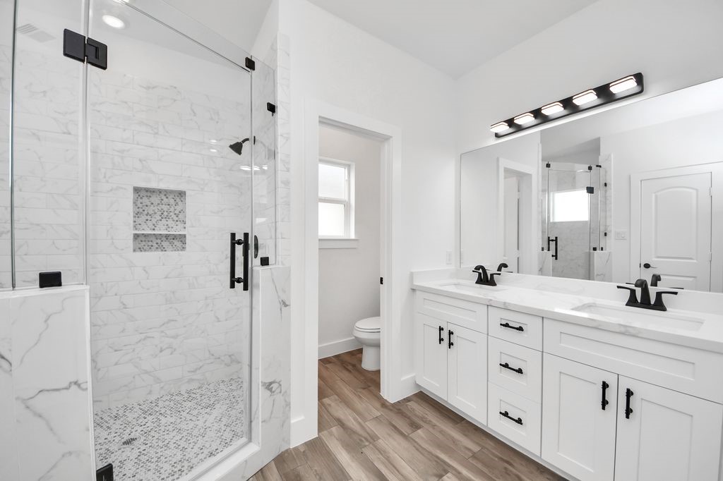 767 Marjorie Street Houston, TX 77088 - Photo 13 of 20 a bathroom with a double vanity sink mirror and shower