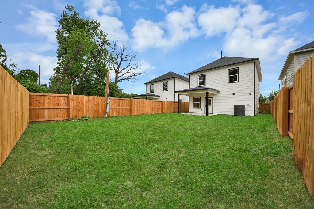 767 Marjorie Street Houston, TX 77088 - Photo 18 of 20 a front view of house with yard