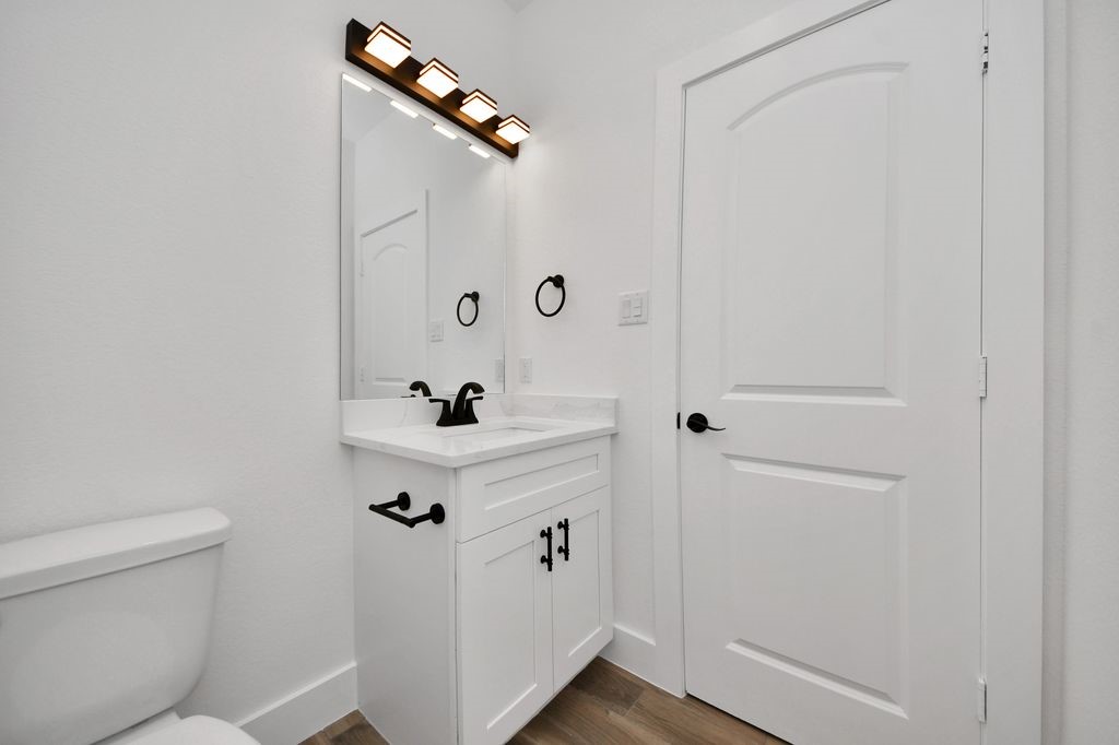 767 Marjorie Street Houston, TX 77088 - Photo 10 of 20 a bathroom with a shower a toilet and sink