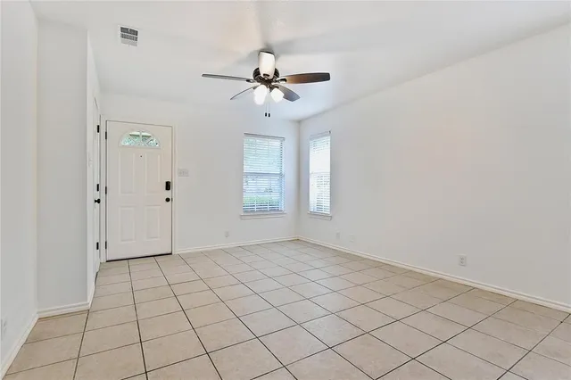 a view of an empty room and window