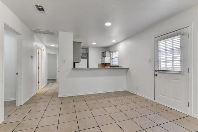 a view of an empty room and window