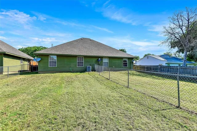 a house with swimming pool in front of it