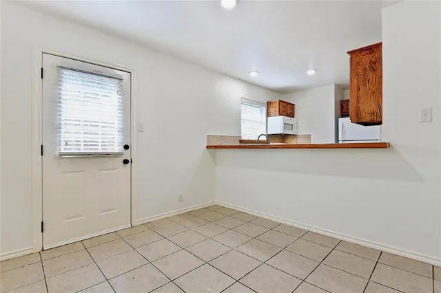 a view of a livingroom with a ceiling fan and window