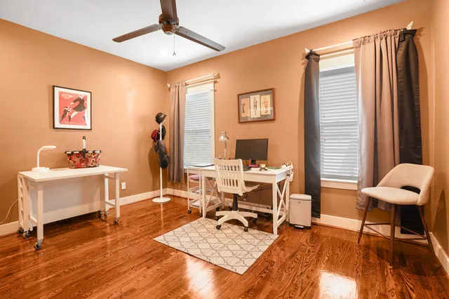 a work room with furniture and wooden floor