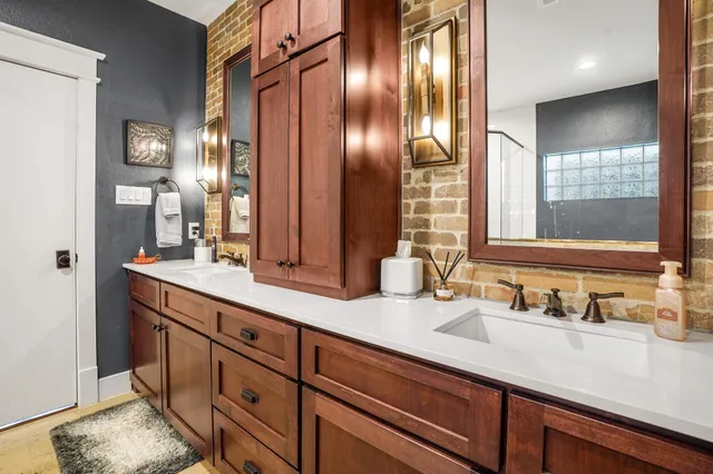 a bathroom with double vanity sinks double vanity and a mirror
