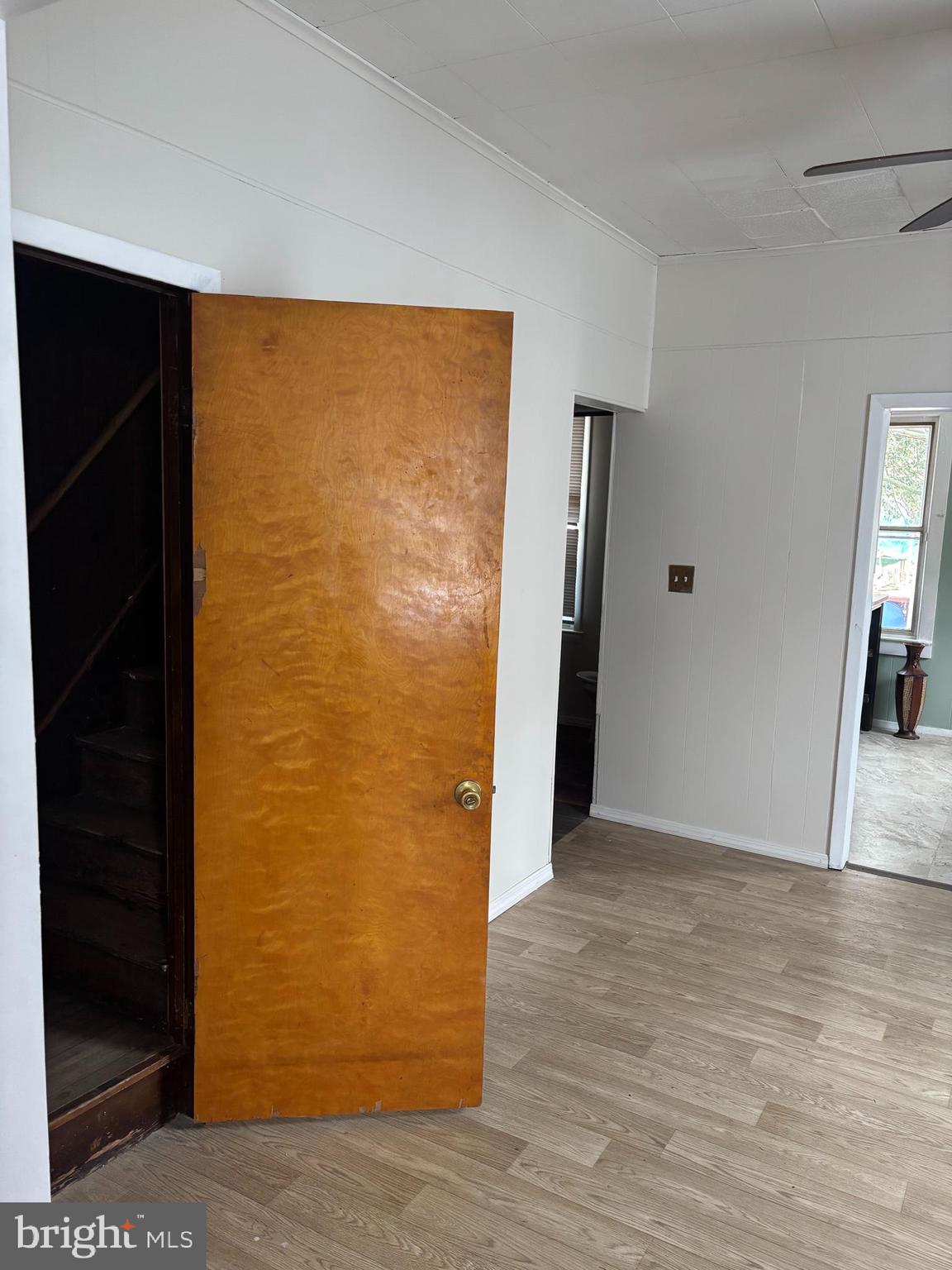 2 Blacks Terrace Paulsboro, NJ 08066 - Photo 11 of 24 a view of an empty room with wooden floor and a bathroom