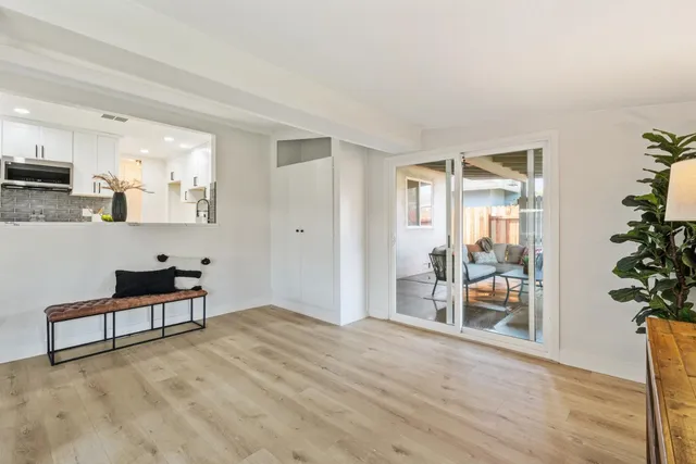 a view of a livingroom with furniture and an entryway