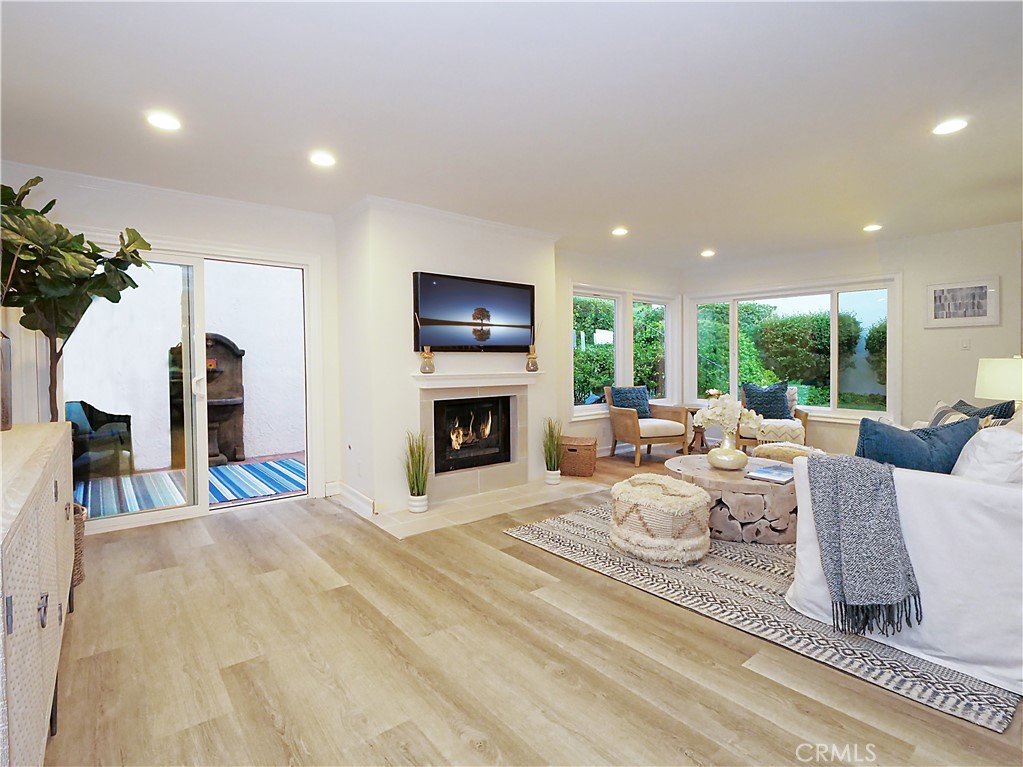 41 Oaktree Lane Rolling Hills Estates, CA 90274 - Photo 15 of 35 a living room with furniture a fireplace and a floor to ceiling window