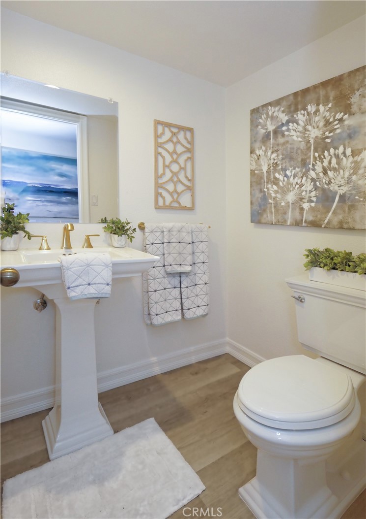 41 Oaktree Lane Rolling Hills Estates, CA 90274 - Photo 18 of 35 a bathroom with a sink and mirror with toilet