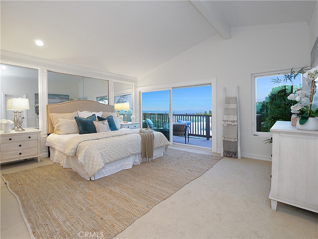 41 Oaktree Lane Rolling Hills Estates, CA 90274 - Photo 19 of 35 a bedroom with a large bed and a potted plant