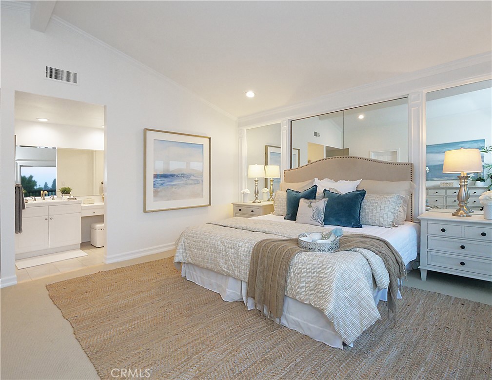 41 Oaktree Lane Rolling Hills Estates, CA 90274 - Photo 23 of 35 a spacious bedroom with a large bed and a view of kitchen