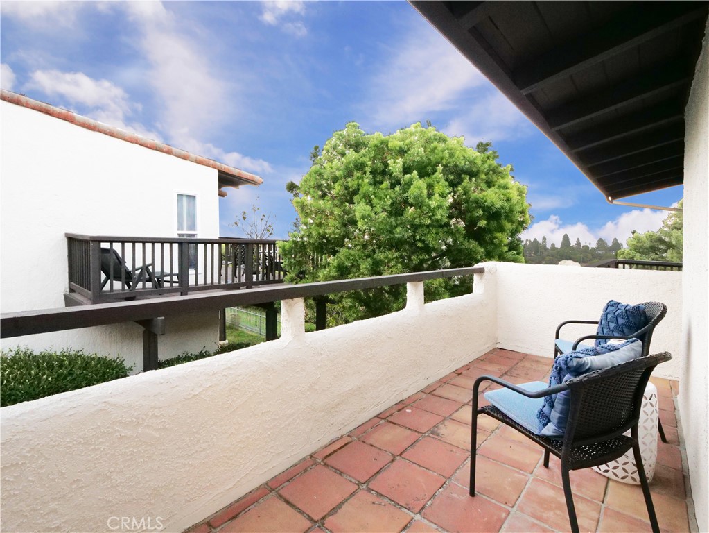41 Oaktree Lane Rolling Hills Estates, CA 90274 - Photo 26 of 35 a view of a chairs and table in the balcony