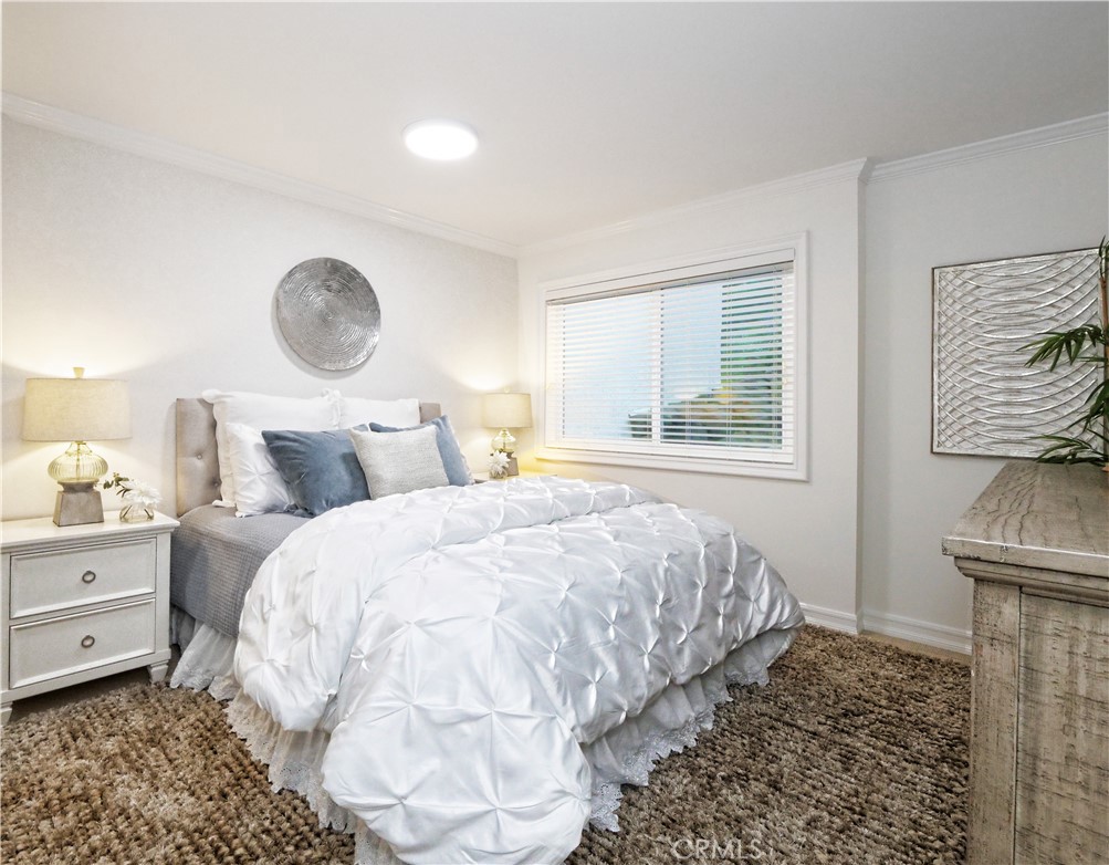 41 Oaktree Lane Rolling Hills Estates, CA 90274 - Photo 27 of 35 a bedroom with a bed and a window