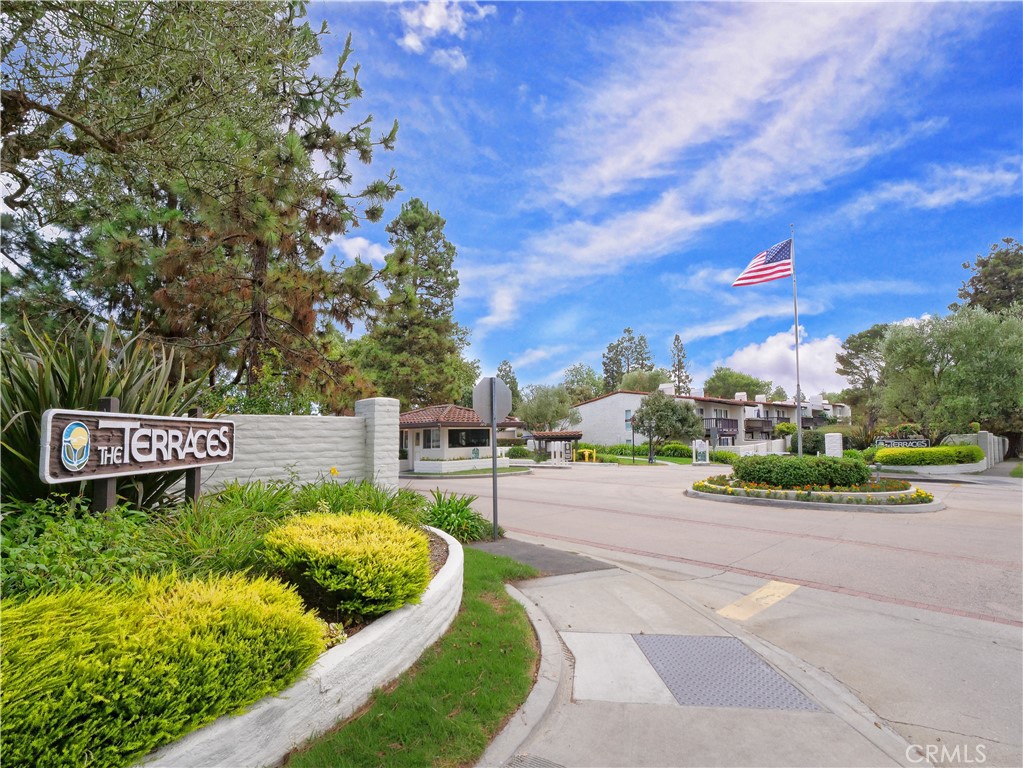 41 Oaktree Lane Rolling Hills Estates, CA 90274 - Photo 30 of 35 a sign board with a small yard and wooden fence