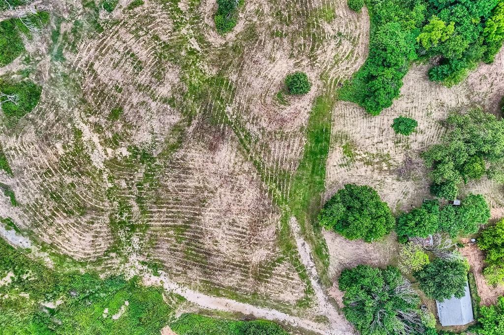 a aerial view of a house with a yard