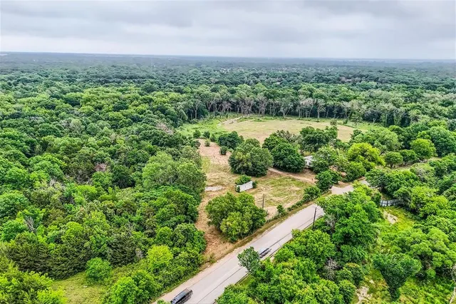 an aerial view of residential house with outdoor space