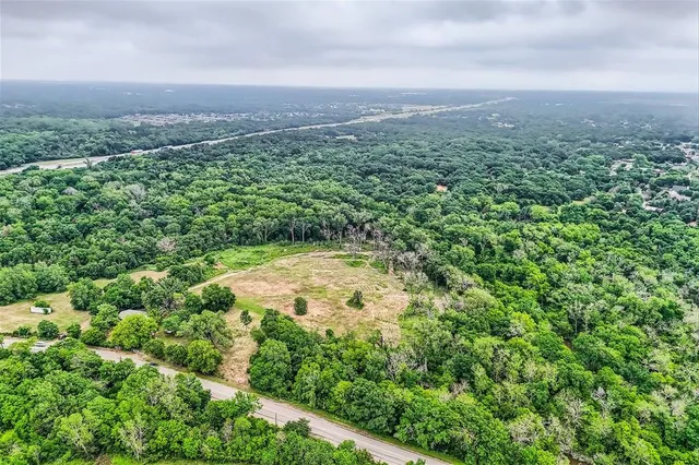 an aerial view of residential house with outdoor space