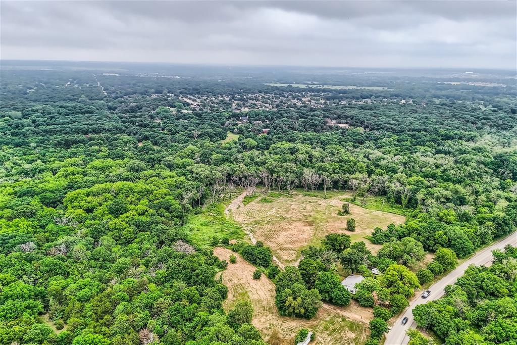 2320 Dowdy Ferry Road Dallas, TX 75217 - Photo 9 of 11 a view of a yard with a building in the background