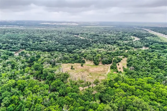 an aerial view of residential house with outdoor space