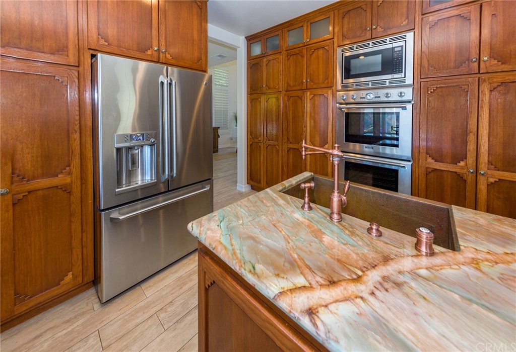3834 Sky View Lane La Crescenta, CA 91214 - Photo 12 of 38 a kitchen with stainless steel appliances granite countertop a refrigerator and microwave