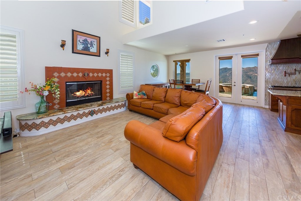 3834 Sky View Lane La Crescenta, CA 91214 - Photo 15 of 38 a living room with furniture and a fireplace