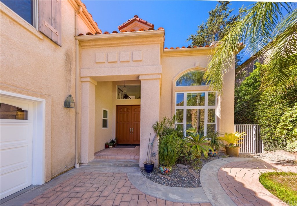 3834 Sky View Lane La Crescenta, CA 91214 - Photo 2 of 38 a view of a house with a small yard plants and large tree