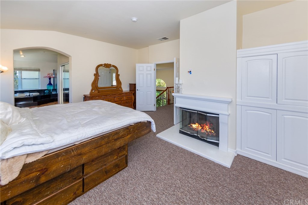 3834 Sky View Lane La Crescenta, CA 91214 - Photo 21 of 38 a bedroom with a bed and a fireplace